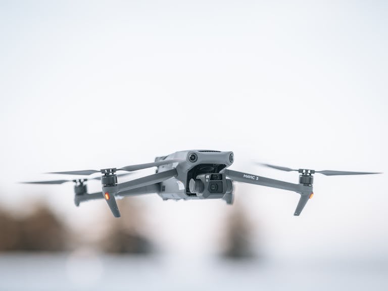 Close-Up Shot of a White Drone Flying